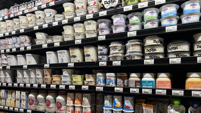 Yogurt on display in a supermarket dairy aisle