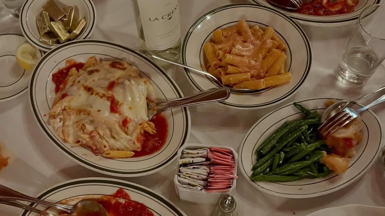 Pasta and veggies are served on a table.
