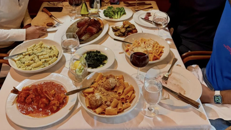 Pasta dishes are sitting on a table.
