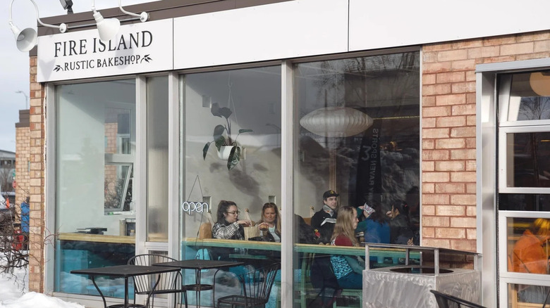 a look through the window at folks eating inside Fire Island Rustic Bakeshop