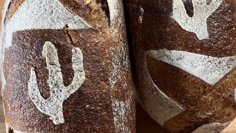 A close-up shot of Barrio's signature loaf, baked with a saguaro pattern in the crust