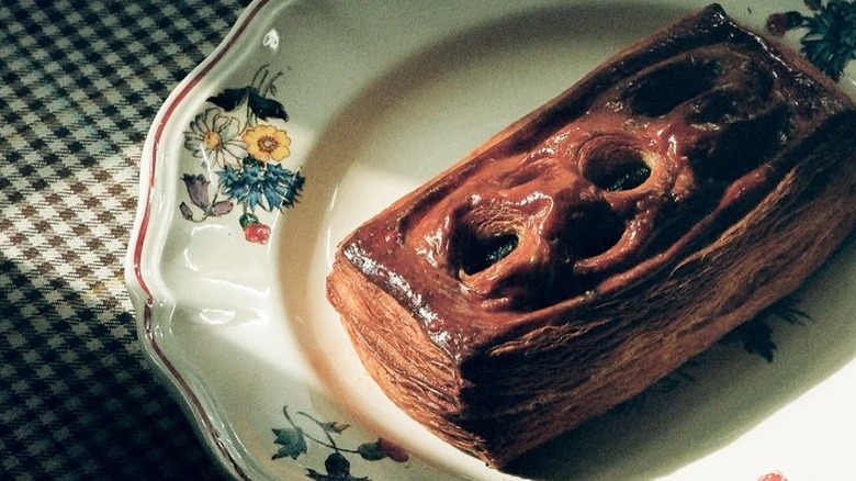 Lagniappe pastry chef Kaitlin Guerin's signature, invented treat the vaucroissant served on a delicate, ceramic plate