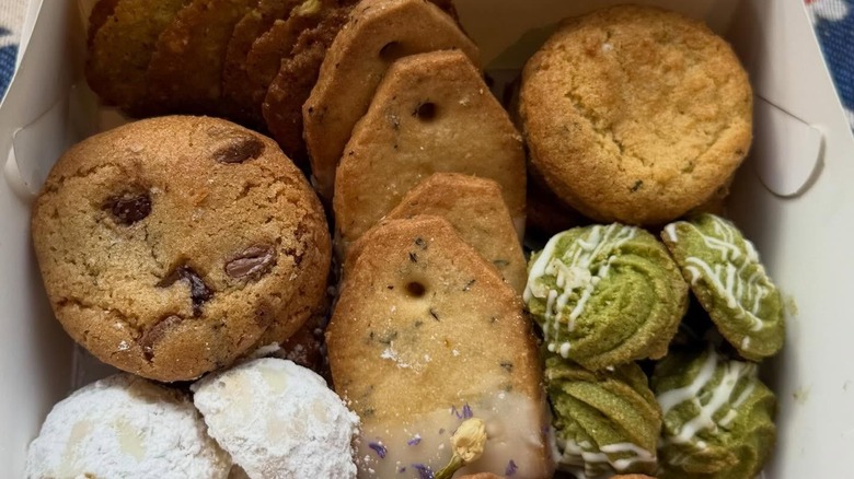 a white bakery box filled with assorted pastries and baked goods from Ovenbird Bakery