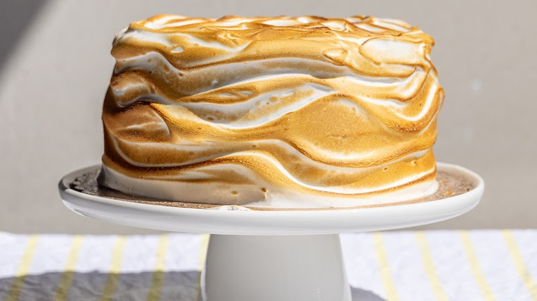 A photo of Zingerman's Lemon Sponge Cake, frosted with slightly-burnt meringue