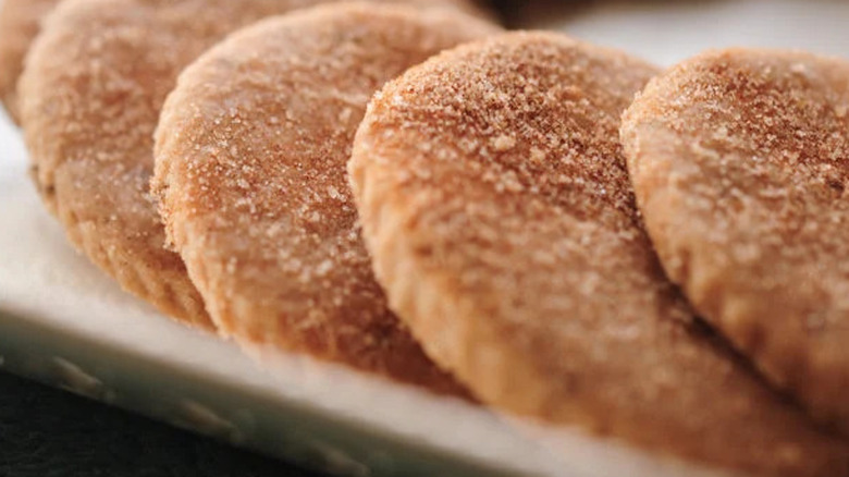 A zoomed-in photo of a serving plate filled with Golden Crown Panaderia's signature Biscochitos