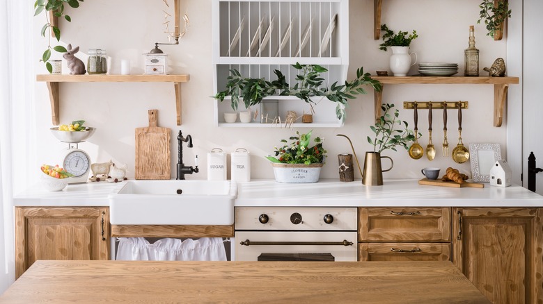 A farmhouse kitchen with hanging shelves