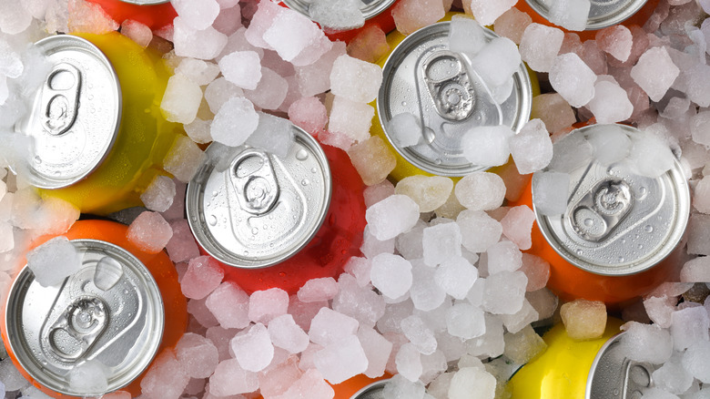 A variety of soda cans in ice