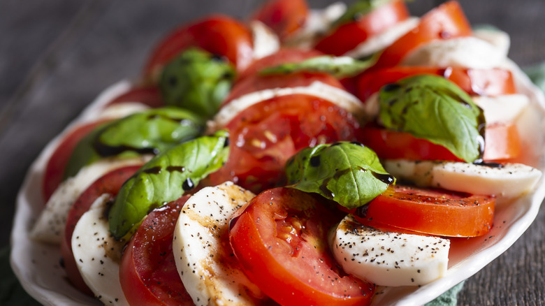 caprese salad on a white platter