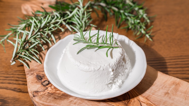 Ricotta cheese on wooden board