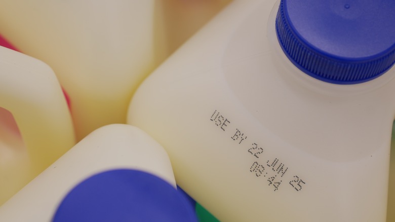 Milk containers showing expiration dates