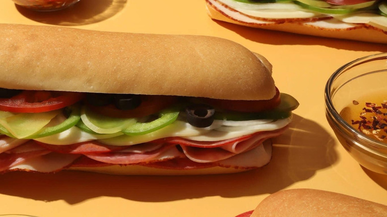 Sandwiches and a side of oil from Moe's Italian Sandwiches.