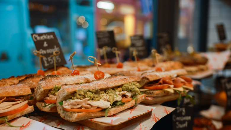 Fresh sandwiches and subs at an Italian deli counter.