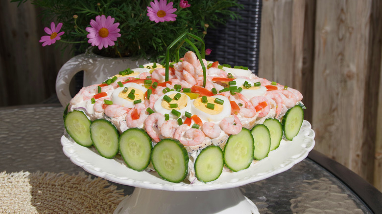 Smörgåstårta cake served on a platter.