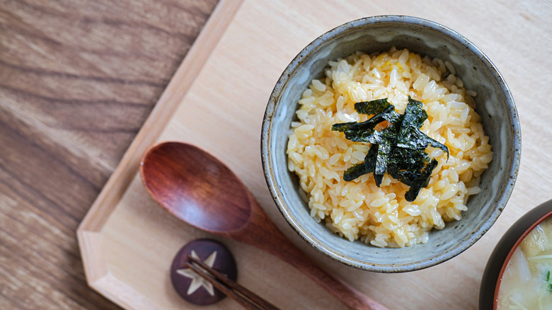 A bowl of eggy rice, topped with nori