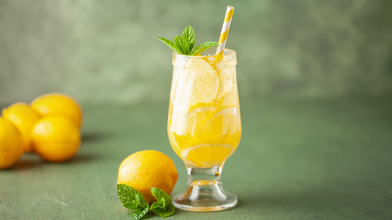 lemon drink pictured with mint garnish and straw