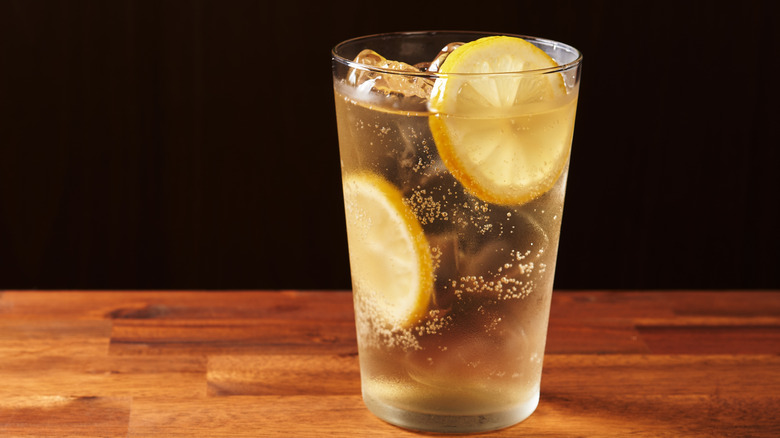 a lemon mixed drink on the rocks on bar