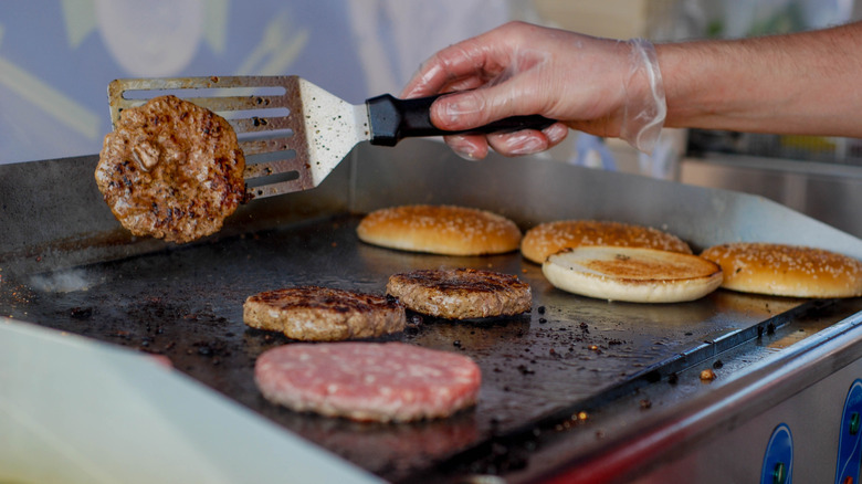 Cooking patties for hamburgers.