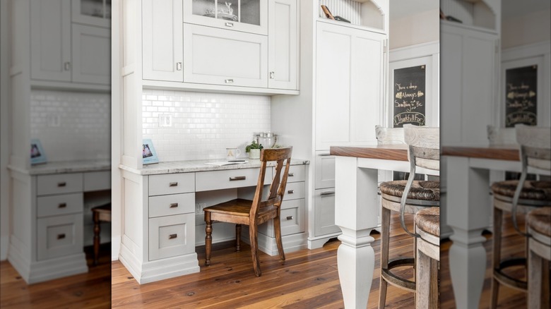a kitchen desk has a wooden chair haphazardly pushed in, and some random bits and bobs on top