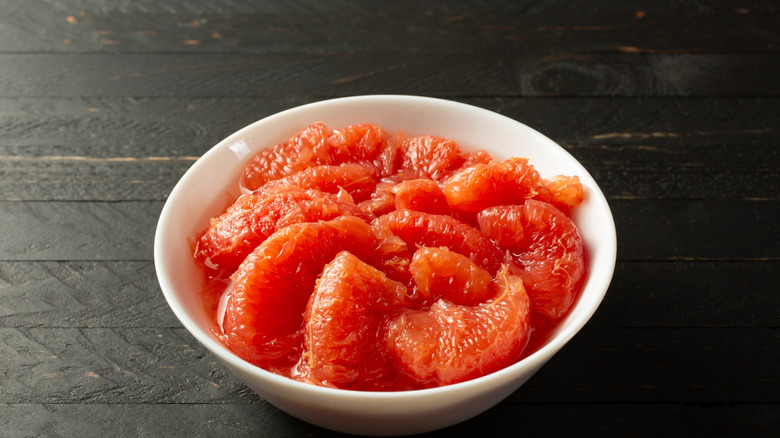 A view of a bowl of canned ruby red grapefruit sections.