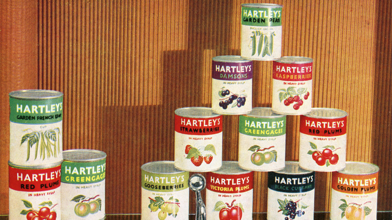 Vintage canned fruit, stacked.