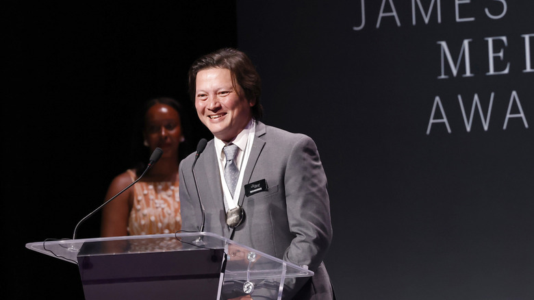 J. Kenji Lopez-Alt smiles on stage at the James Beard Awards
