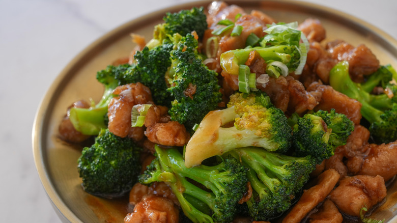 Prepared plate of chicken and broccoli.