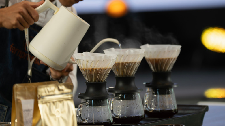 Several coffees being brewed with the pour-over method.