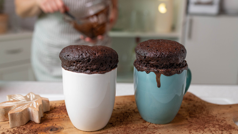 Two cooked chocolate mug cakes
