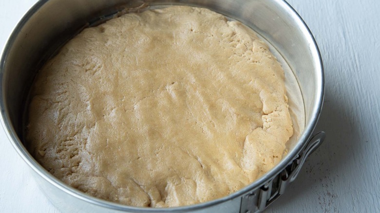 cookie dough pressed in springform pan
