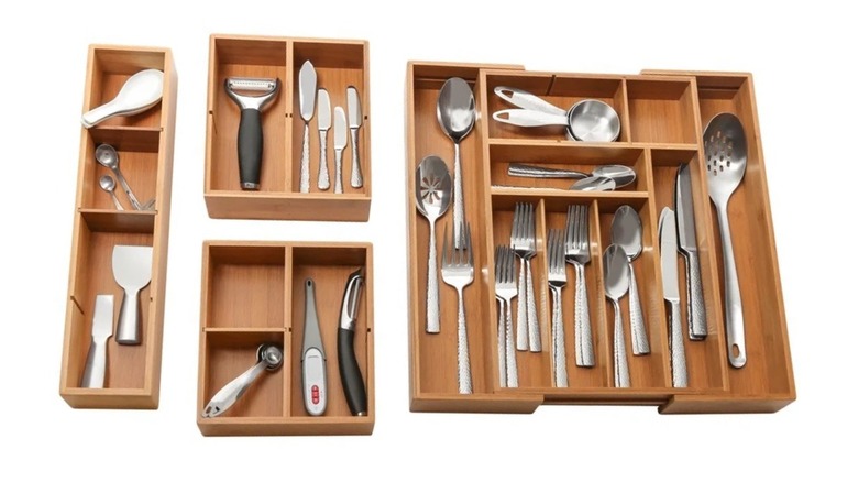 Forks, spoons, knives, ladles, thermometer, and peelers organized in Seville Classics 4-piece Bamboo Expandable Drawer Organizer set