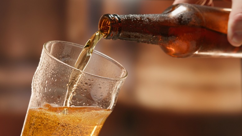 Beer being poured from a bottle