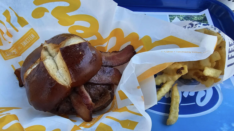 Culver's pretzel burger served on a tray.