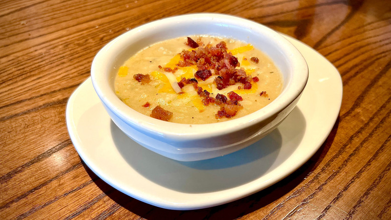 Outback Steakhouse baked potato soup on a wood table