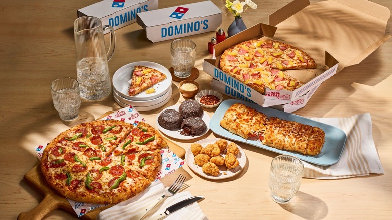 Variety of Domino's Pizza food items and desserts