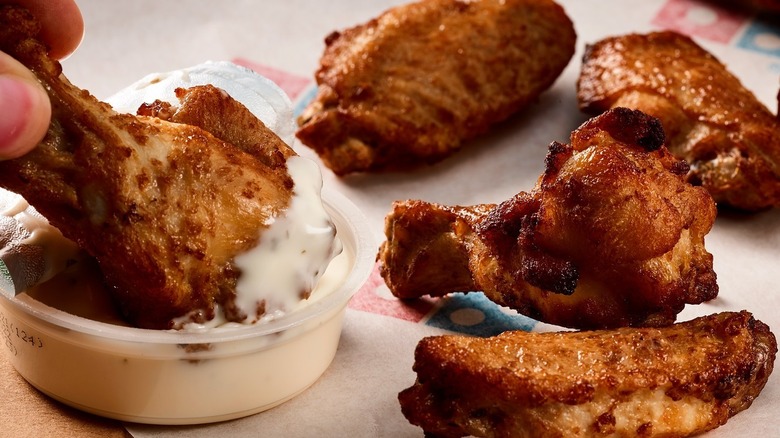 Domino's wings dipped in a condiment