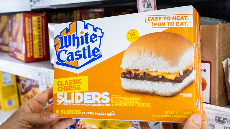 Frozen White Castle burger held in hands.