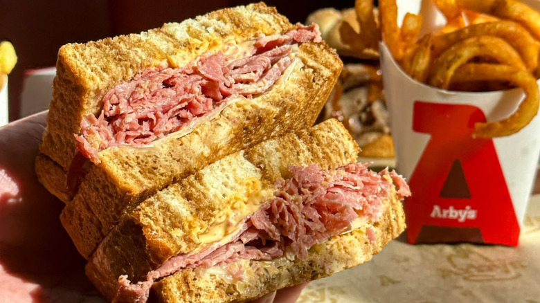 A Reuben sandwich and fries from Arby's.