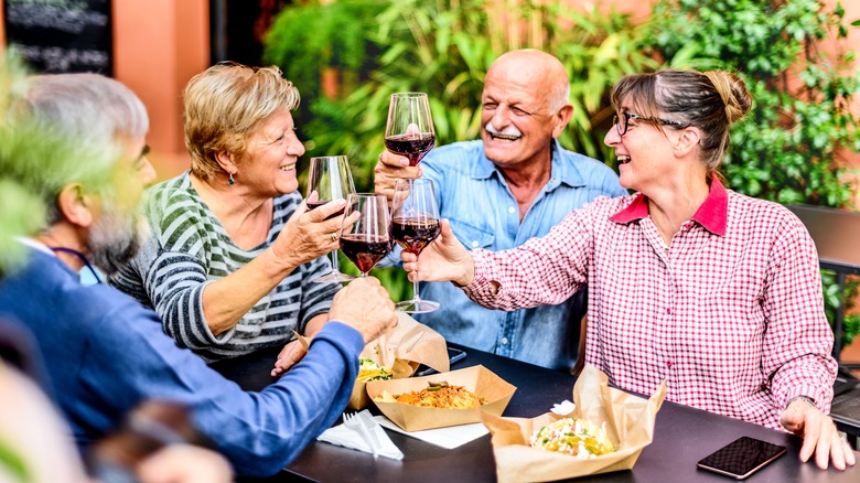 Senior group of friends enjoying a meal