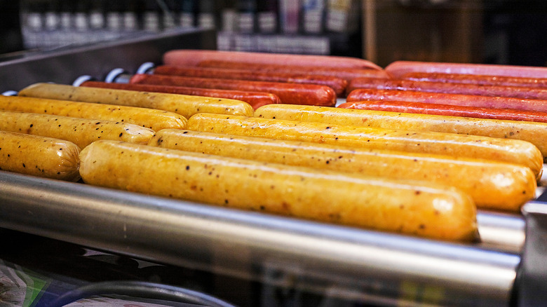 Hot dogs on a roller at a gas station
