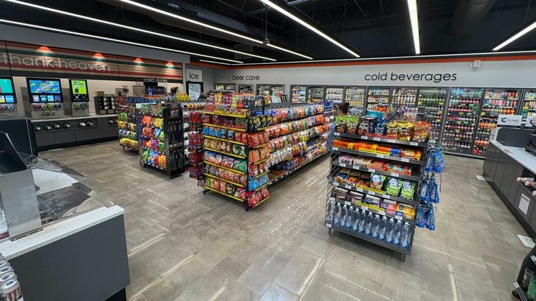 A new 7-Eleven store gleams under bright lights.
