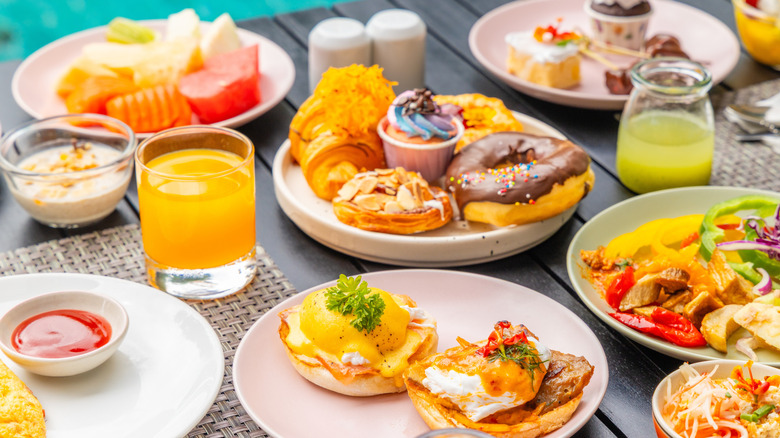 A classic brunch spread featuring egg dishes, fruit, and pastries.