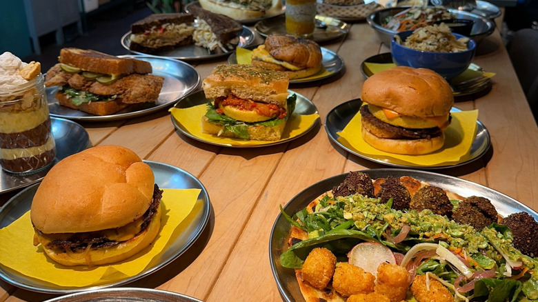 Collection of Odie B's menu offerings on a wooden tabletop