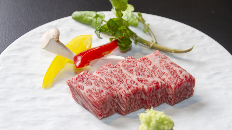 kobe beef sliced onto plate
