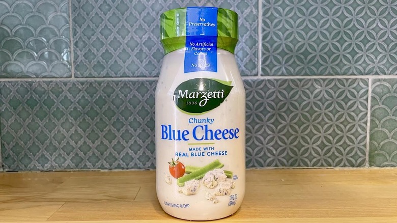 A jar of Marzetti Chunky Blue Cheese Dressing.