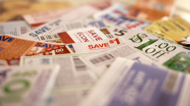 Many coupons rest on top of each other in a pile