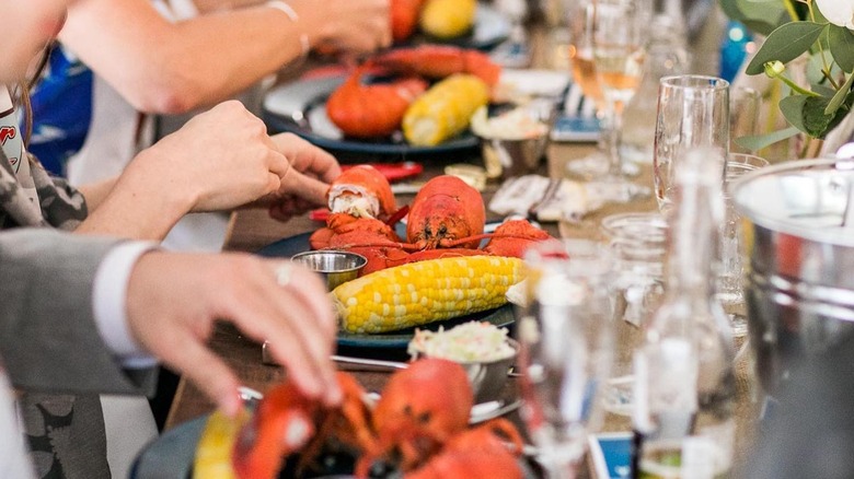 Diners eating lobster and corn at The Spirit Restaurant