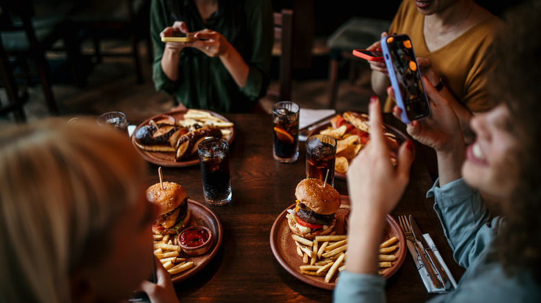 diners photographing meal