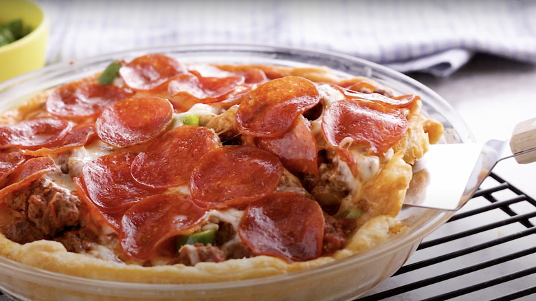 A pizza bake topped with pepperoni with a crescent roll base