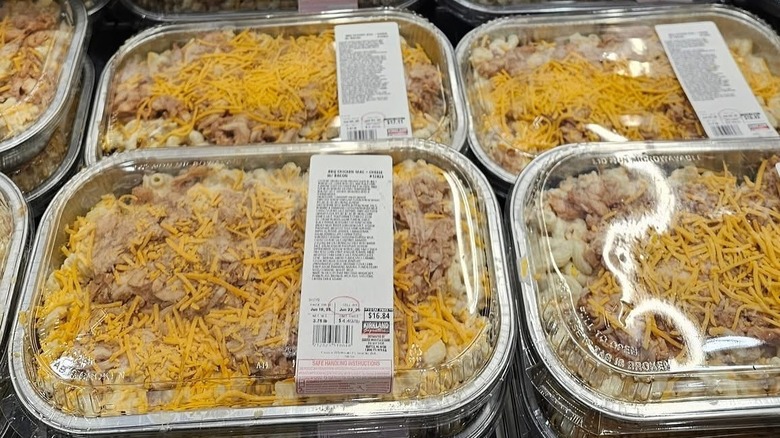 Packages of Costco's BBQ chicken mac and cheese rest in the store