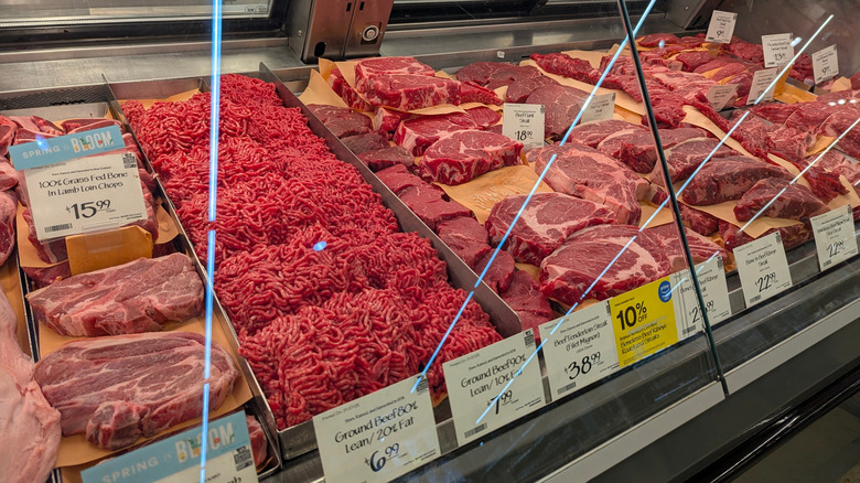 Various meat on display in a supermarket